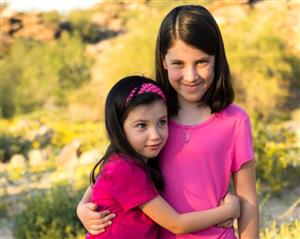 First Grader Anna Oakeson with sister Caitlin 